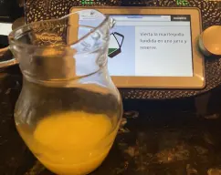 Step <span style="font-weight: 400;">Vierta la mantequilla fundida en una jarra y reserve .</span> illustration